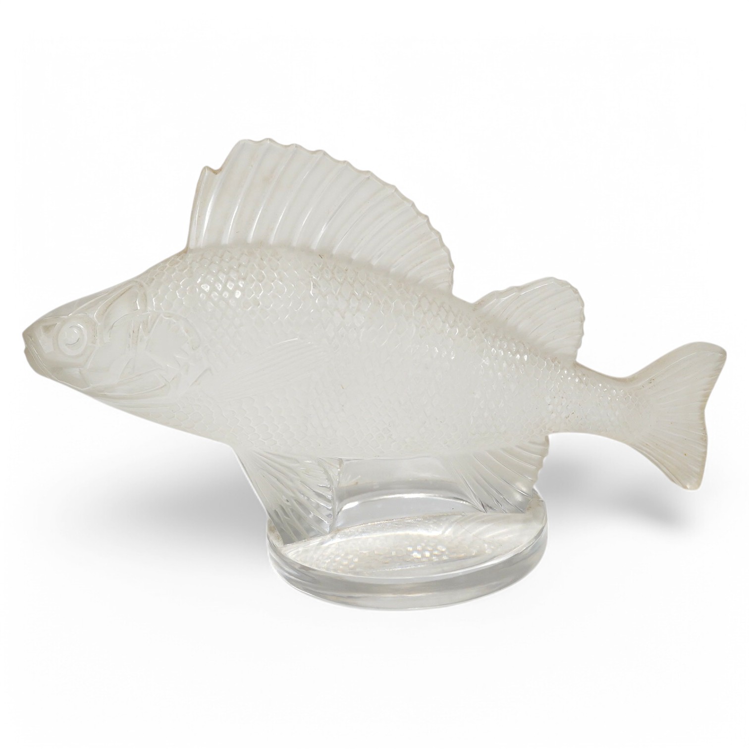 A modern Lalique glass paperweight in the form of a fish, signed to the base, 16cm wide. Condition - good